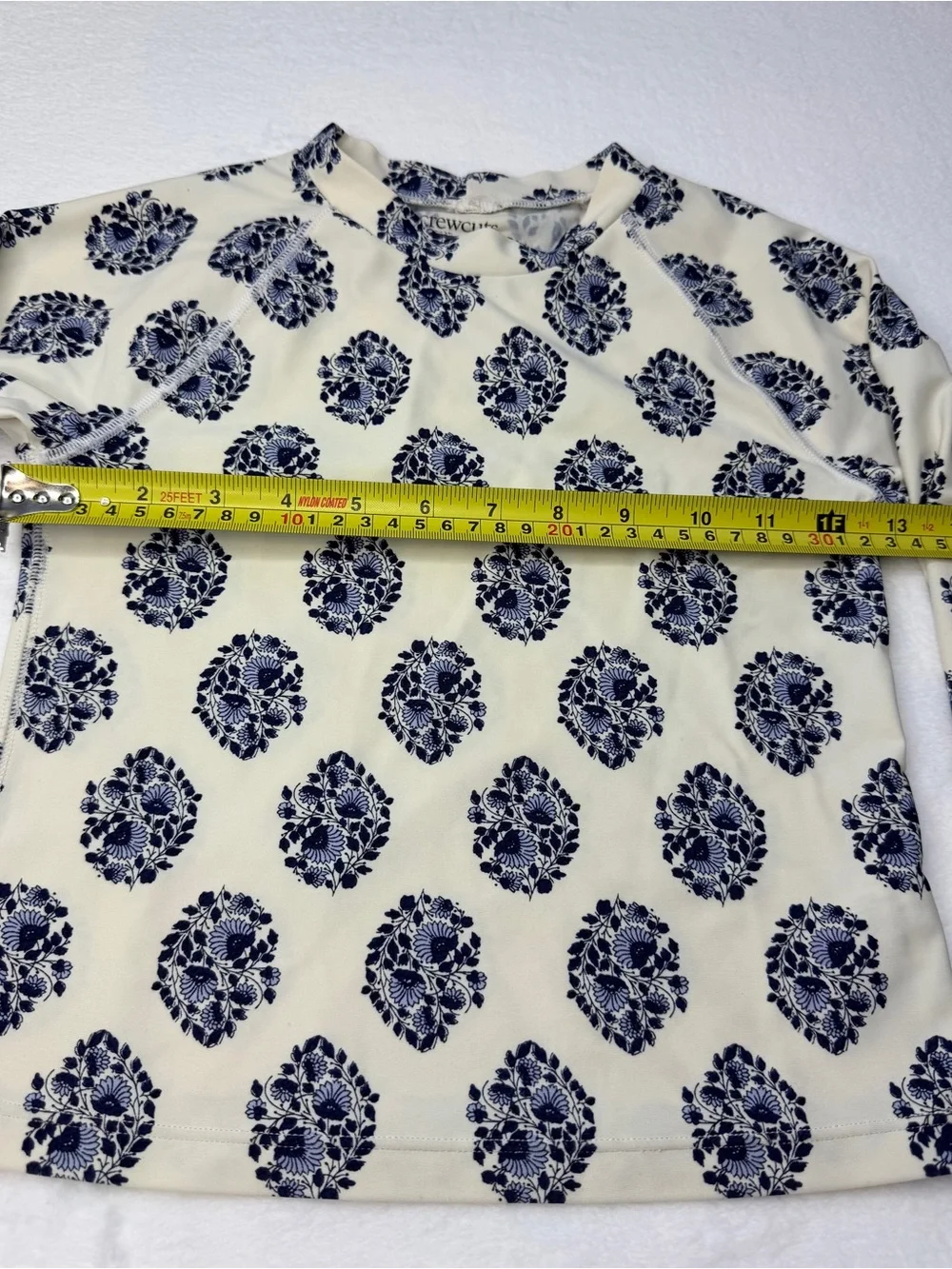 J.Crew long-sleeve rash guard featuring an all-over navy and white floral 6-7